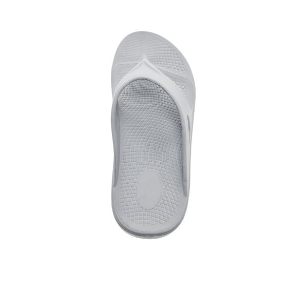A single SOVELLA Sovella Womens PF Thong Light Grey flip-flop, made of rubber, viewed from above, highlights its textured footbed and thong strap with arch support for comfortable recovery sandals on a white background.