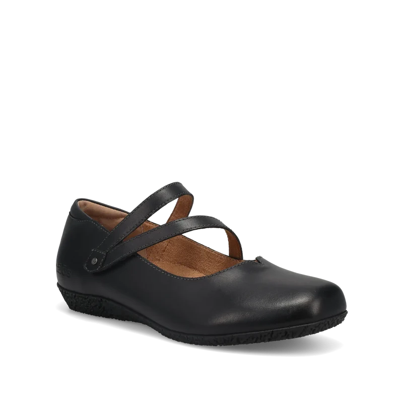 The TAOS Taos Womens Banter Black is a chic luxe leather Mary Jane flat with two diagonal straps, rounded toe, textured sole, arch and metatarsal support, plus a removable footbed for all-day comfort. Shown side view on white background.