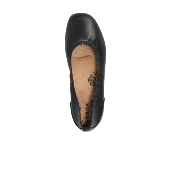 Black flat shoe with brand logo on a white background