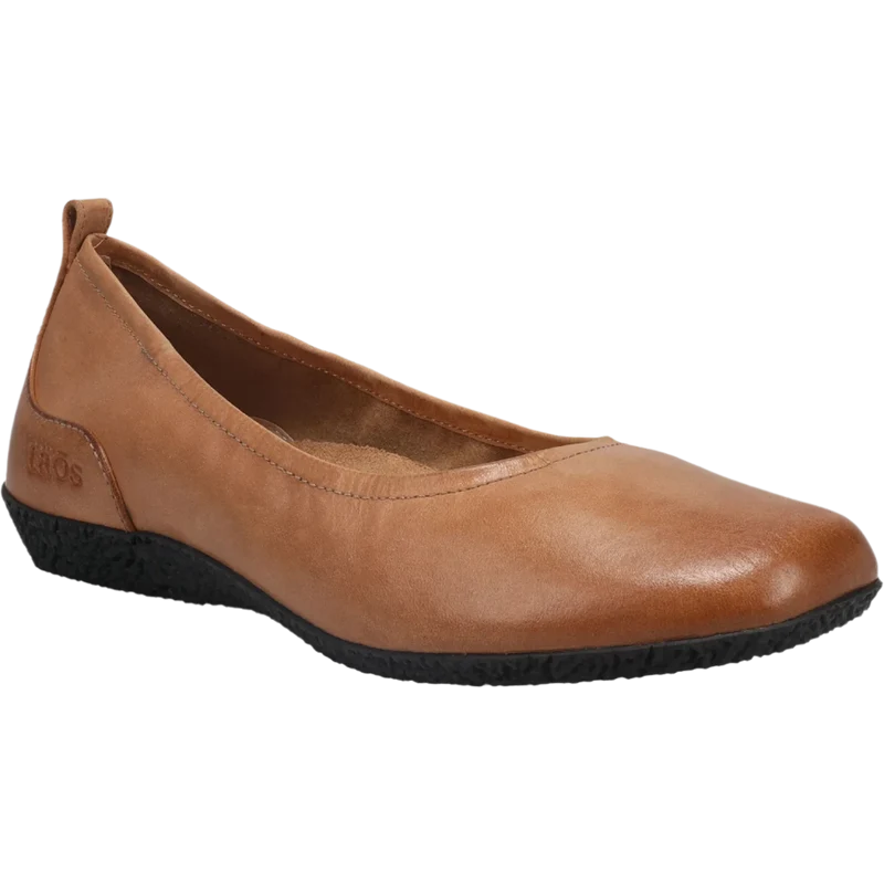 The TAOS Womens Chit Chat Caramel ballet flat features a rounded toe, low black textured sole, small heel pull tab, and removable footbed for extra comfort.