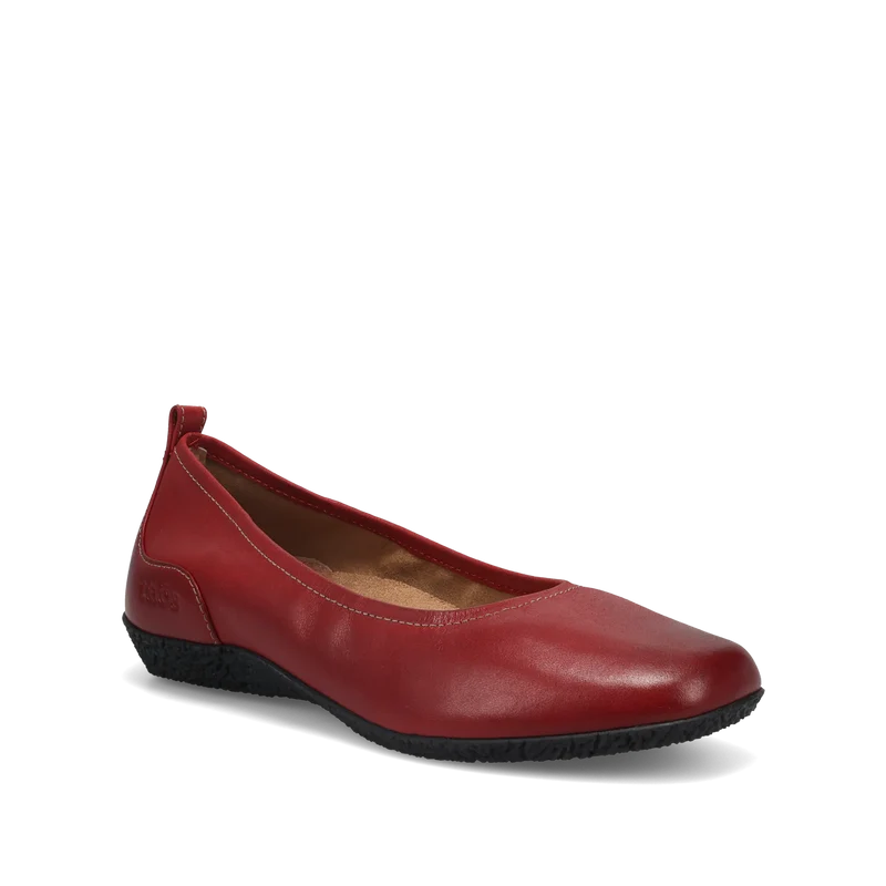 The Taos Womens Chit Chat Red by TAOS is a single red leather skimmer flat with a rounded toe, low black textured sole, subtle stitching, and an orthotic-friendly design, displayed on a white background.