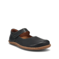 The TAOS Taos Women's Ultimate Leather Mary Jane Black is a comfortable women's flat shoe featuring a black leather upper, brown cork sole, arch support, and top strap. Photographed against a plain white background.
