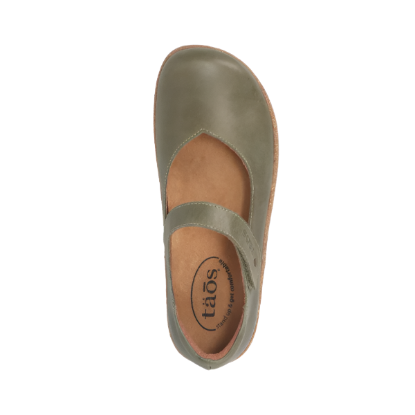 Top view of the Taos Women's Ultimate Leather Mary Jane in Forest by TAOS, featuring green leather, a rounded toe, instep strap, arch support, branded insole, and a light brown sole for all-day comfort.