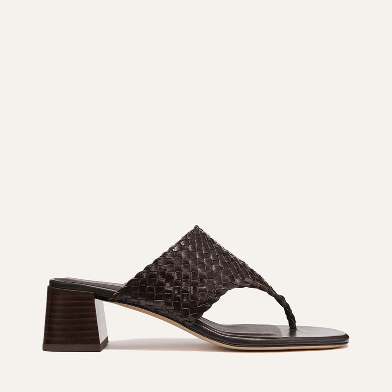 Brown woven sandal on a light beige background