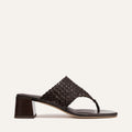 Brown woven sandal on a light beige background