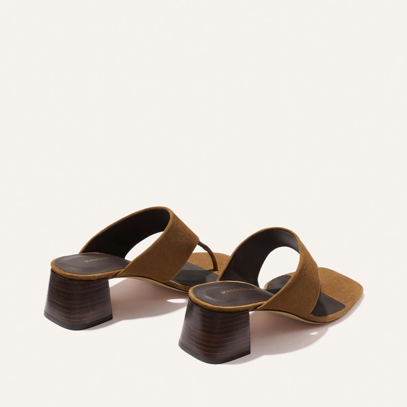 The Deia 50 - Nutmeg Suede by Margaux: brown suede heeled sandals with two wide straps and chunky wooden block heels, shown on a plain white background.