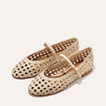 A ecru woven Mary Jane flat made from handwoven leather with a classic strap.