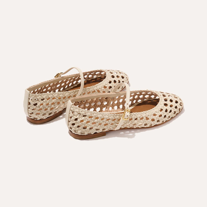 A ecru woven Mary Jane flat made from handwoven leather with a classic strap.