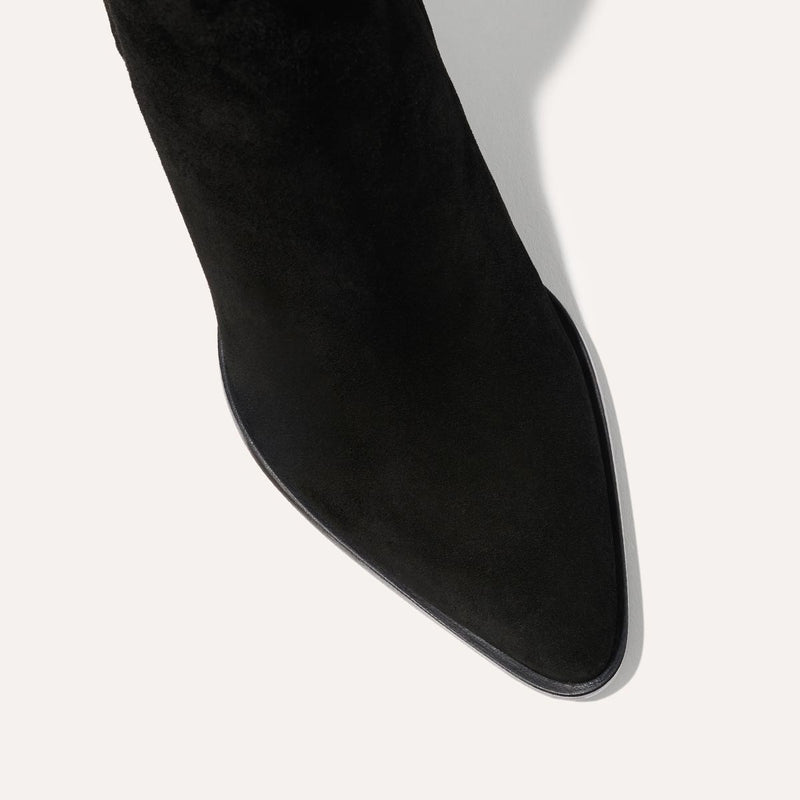 The Downtown Boot in Black Suede, a chic ankle-height design complete with a Western-inspired welt and a comfortable 2.5-inch stacked heel.