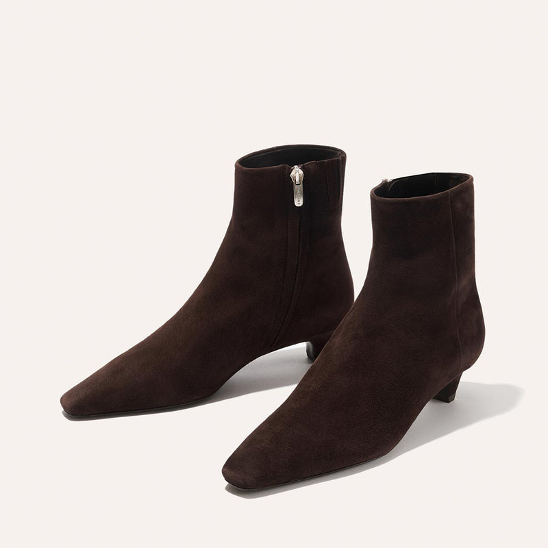 The Inga - Espresso Suede by margaux-development features dark brown suede, pointed toes, low kitten heels, and side zippers—an on-the-go staple for New York City style—displayed against a plain light background.