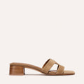 The MX 35 - Biscotti Suede by Margaux features a tan suede slide design with wide double straps and a medium stacked block heel, showcased on a simple light background.