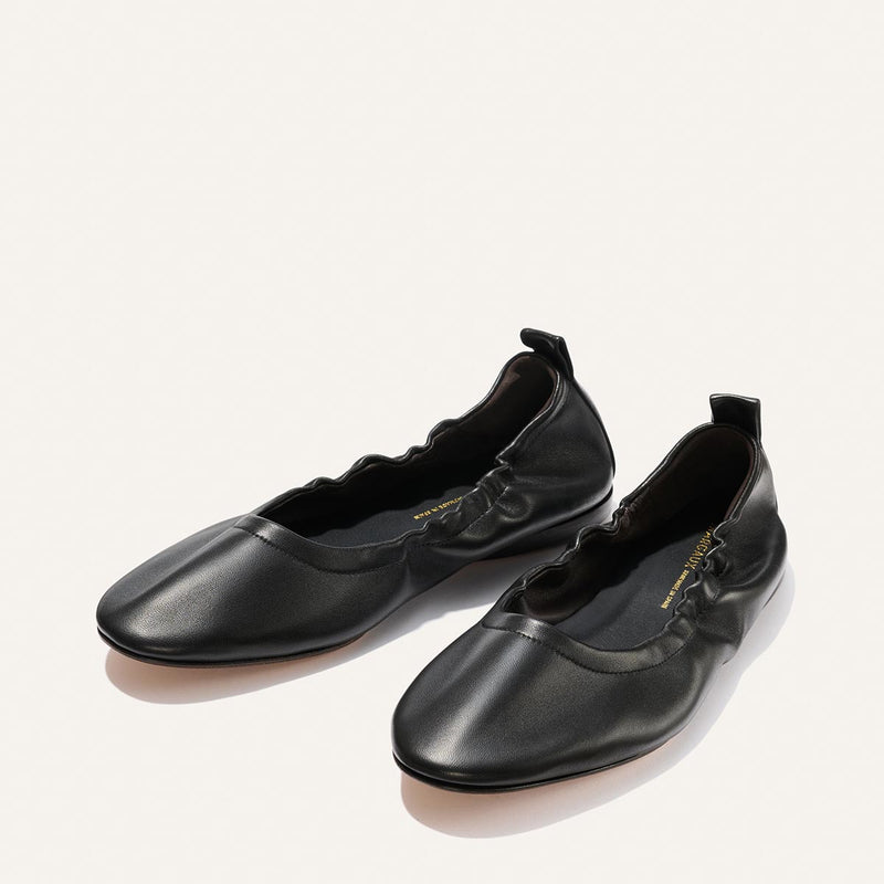 Margaux’s The Pascale - Black Nappa features ruched sides and elasticized edges, shown here in classic black on a light neutral backdrop.