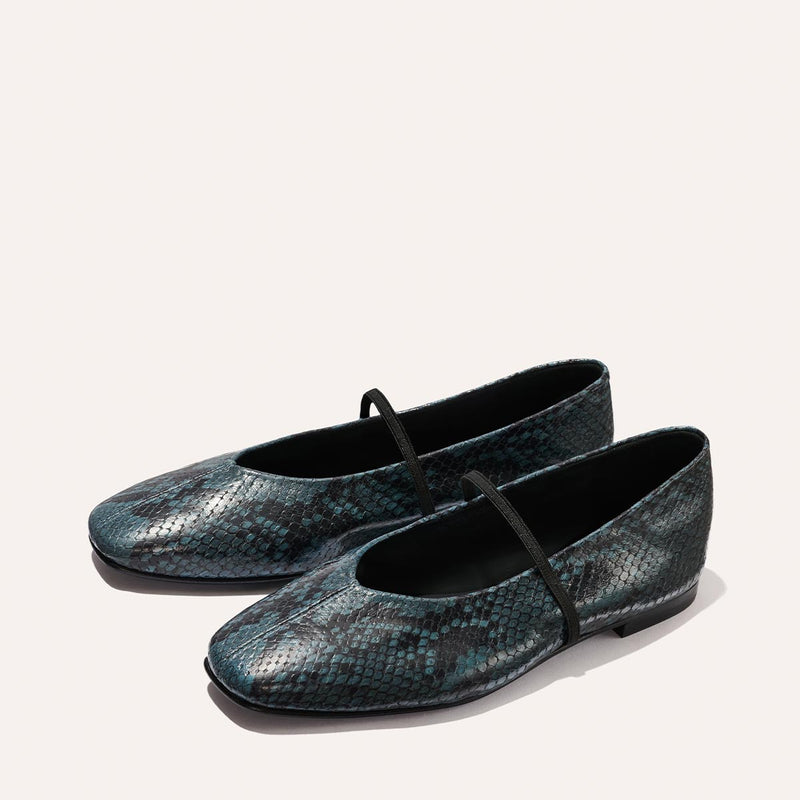 The Phoebe - Aqua Python Embossed by Margaux: flat ballet shoes featuring a dark teal and black snakeskin pattern with a slim black strap across the top, shown on a light background.