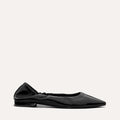 The Roma in Black Crinkle Patent by Margaux—a comfortable pointed-toe ballet flat with a low heel and gathered elastic at the heel—displayed on a light background.