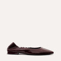 The Roma - Merlot Crinkle Patent by Margaux: a dark burgundy patent leather pointed-toe ballet flat with a low heel and gathered heel detail, showcased on a plain light background.