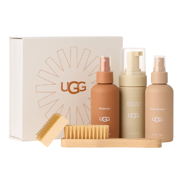 The UGG Care Kit by UGG comes in a white sunburst box and includes Protector, Cleaner & Conditioner, Shoe Renew sprays, two wooden brushes, and a cleaning block—perfect for sheepskin boot care.